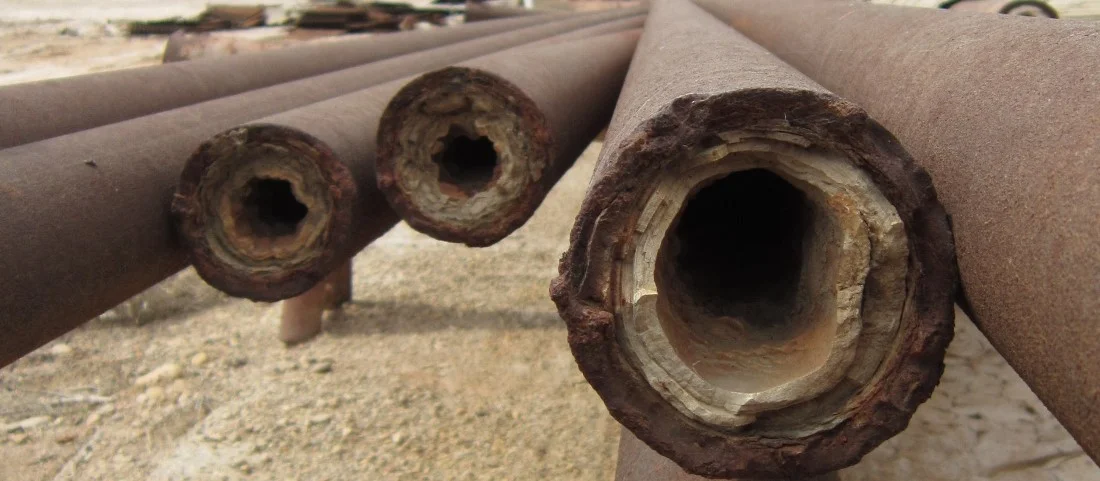 Scaling in Oil Wells and Pipelines