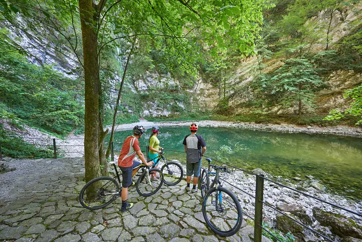 Cyclists at Wild Lake (Divje jezero) near Idrija