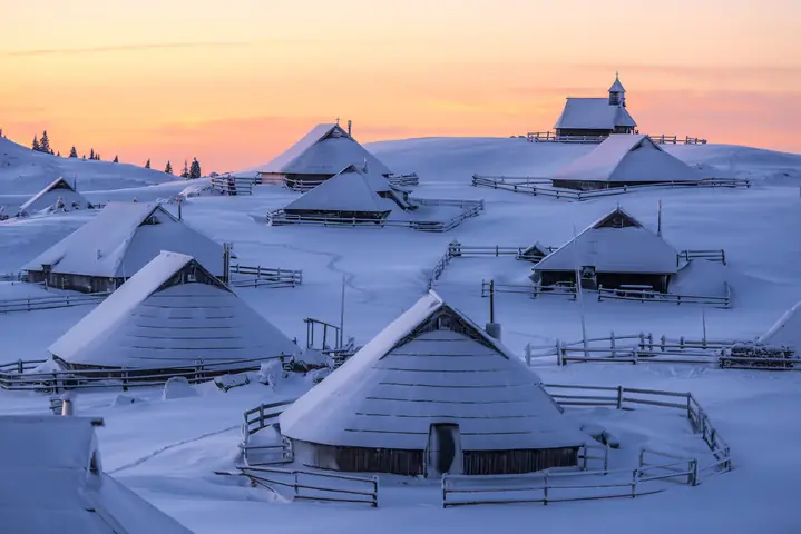 Herdsmen's huts of Velika planina under snow