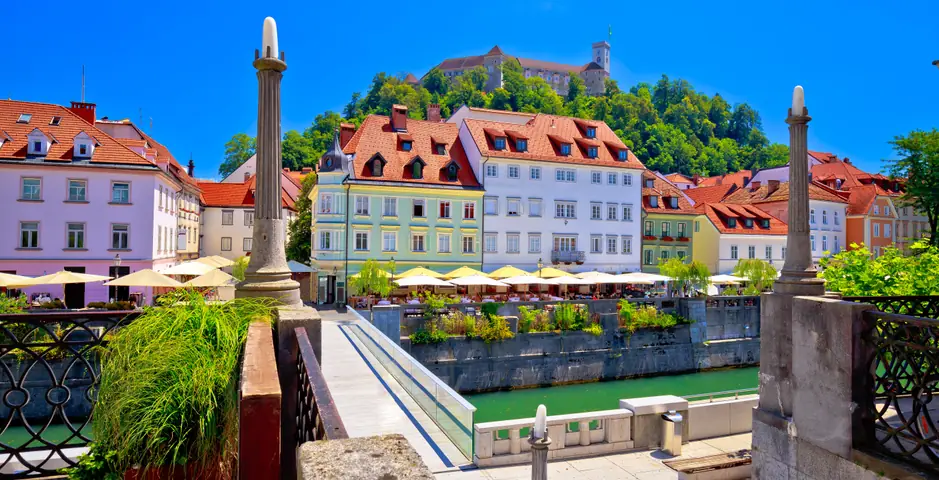 Ljubljanica riverfront with Ljubljana Castle above
