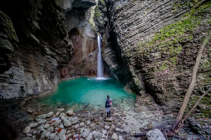 Hiker in front of Kozjak Waterfall